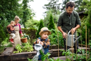family in vegetable garden