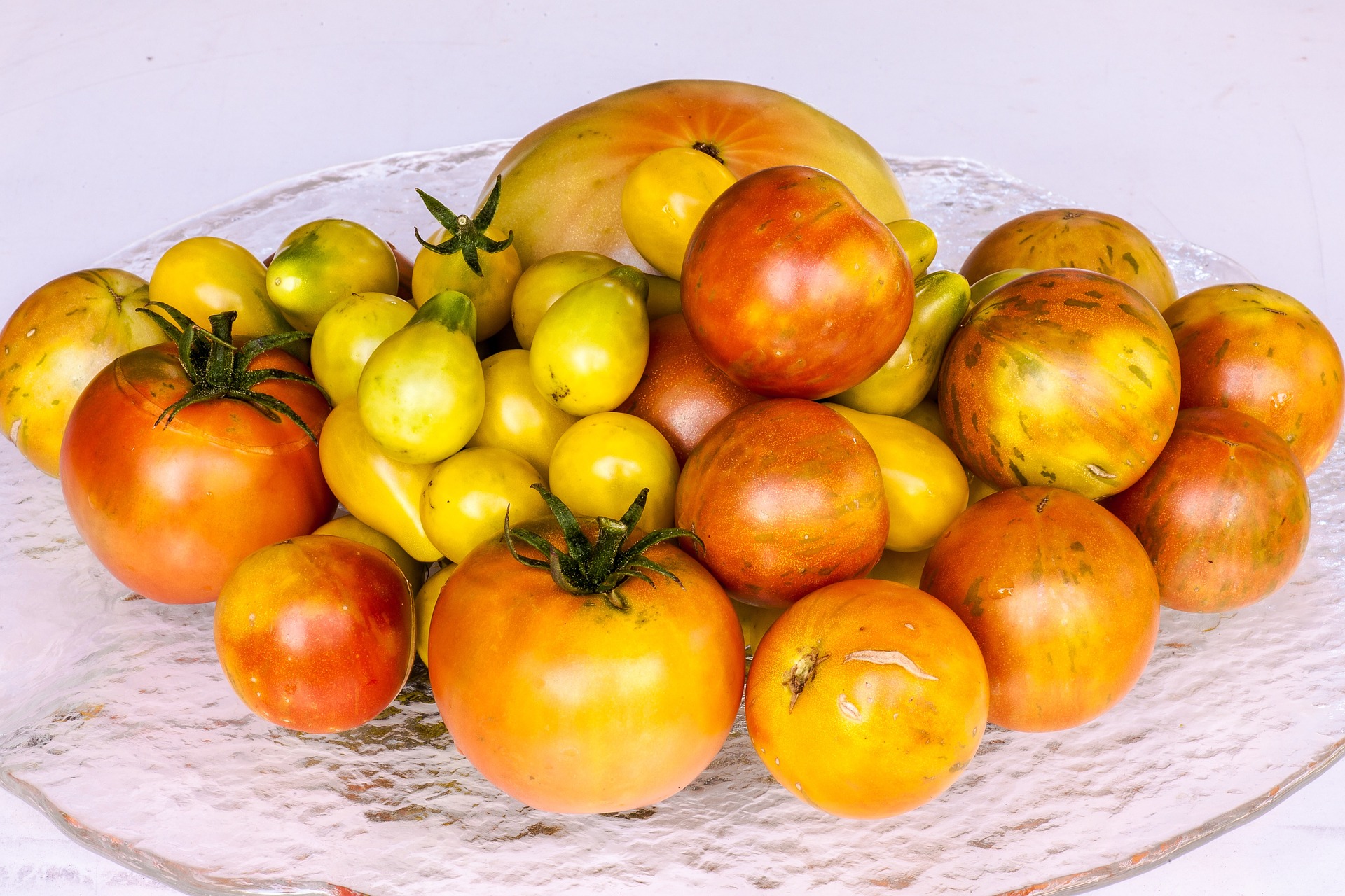Preserve tomatoes now to enjoy the sweet rewards of your summer veggie garden long after harvest season is over.