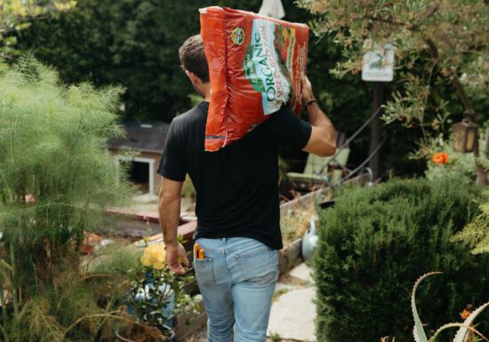 Farmer Nick with a bag of soil
