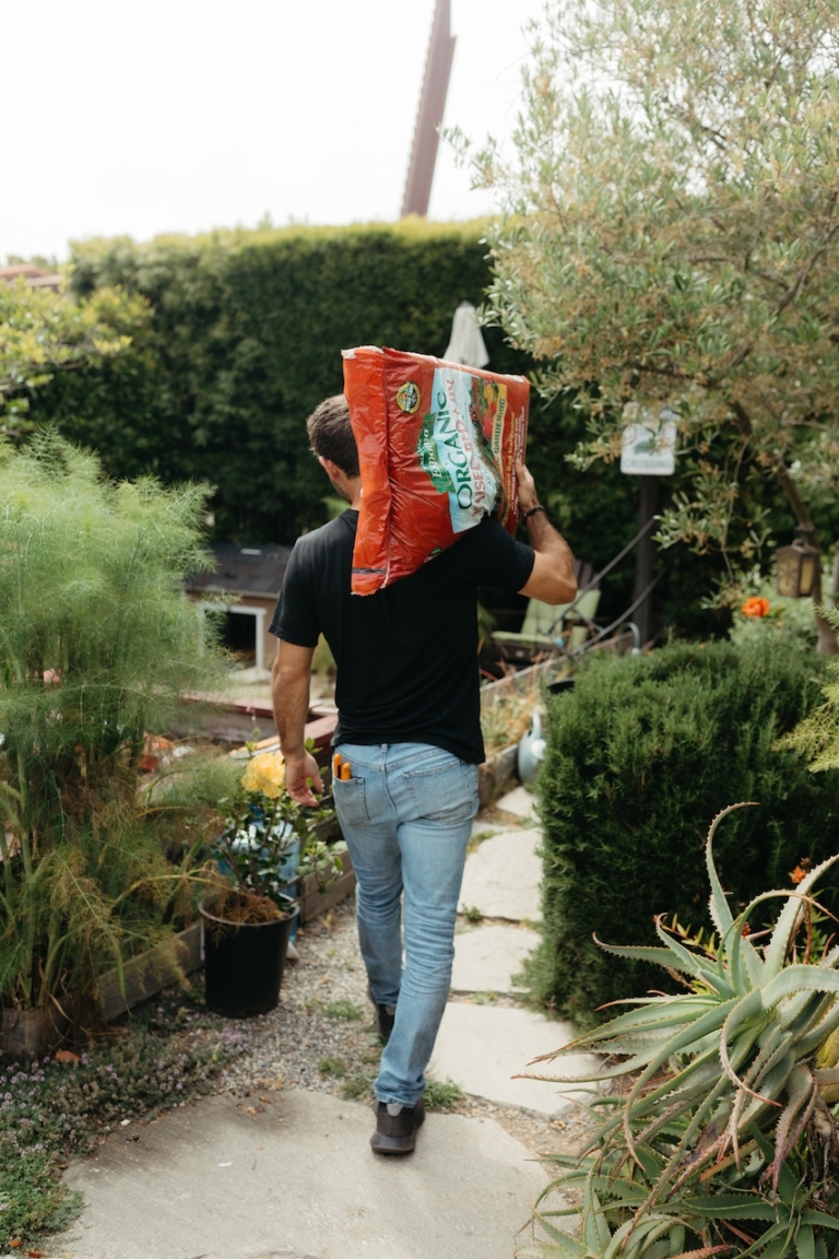 Farmer Nick with a bag of soil