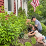 Man and daughter working in the garden