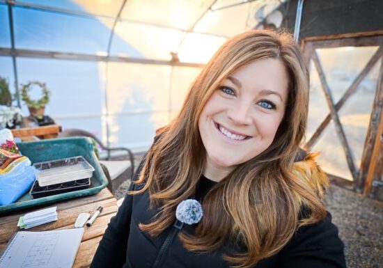 Laura from Garden Answer in her greenhouse