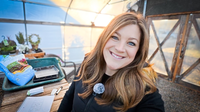 Laura from Garden Answer in her greenhouse