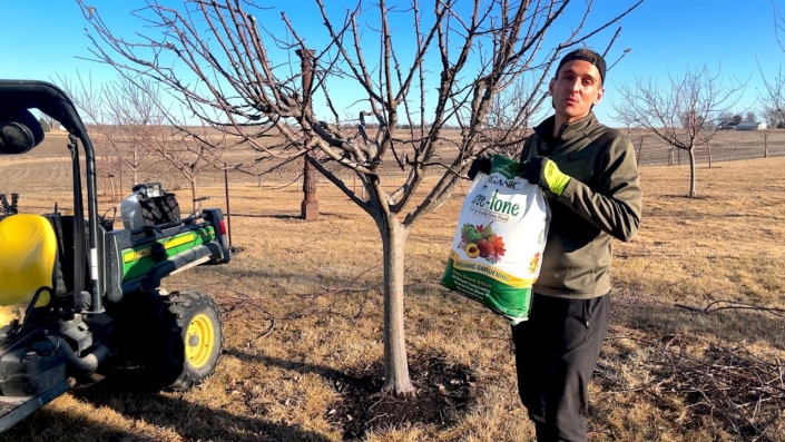 Kaleb Wyse with Espoma Organic Tree-tone