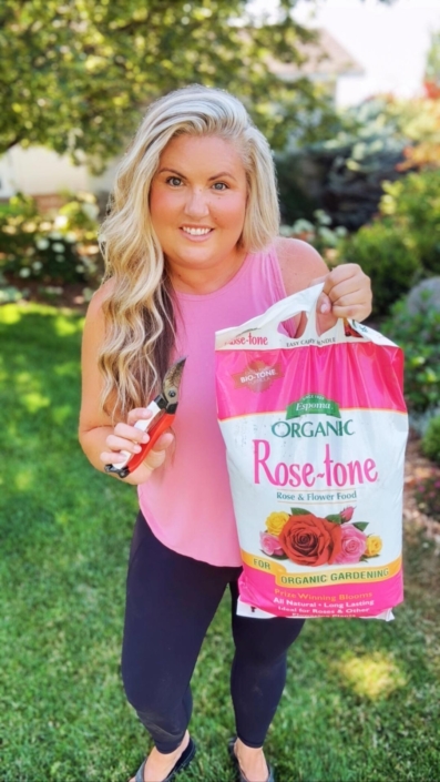 SKYE_Rose-tone_Edited Skye Hamilton holding Espoma Organic Rose-tone (organic fertilizer for roses)